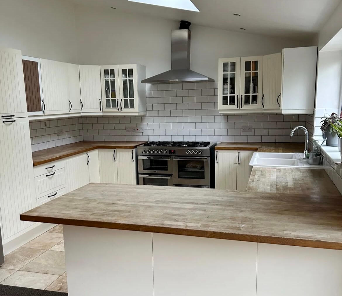 Cream shaker kitchen before professional kitchen cabinet painting by Wilkinson Specialist Sprays in Wombourne.