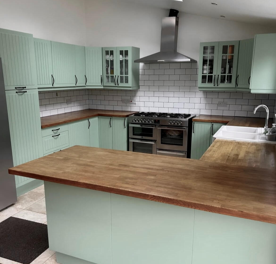 Sage green shaker kitchen professionally hand painted by Wilkinson Specialist Sprays, giving the kitchen a fresh modern finish in Wombourne.