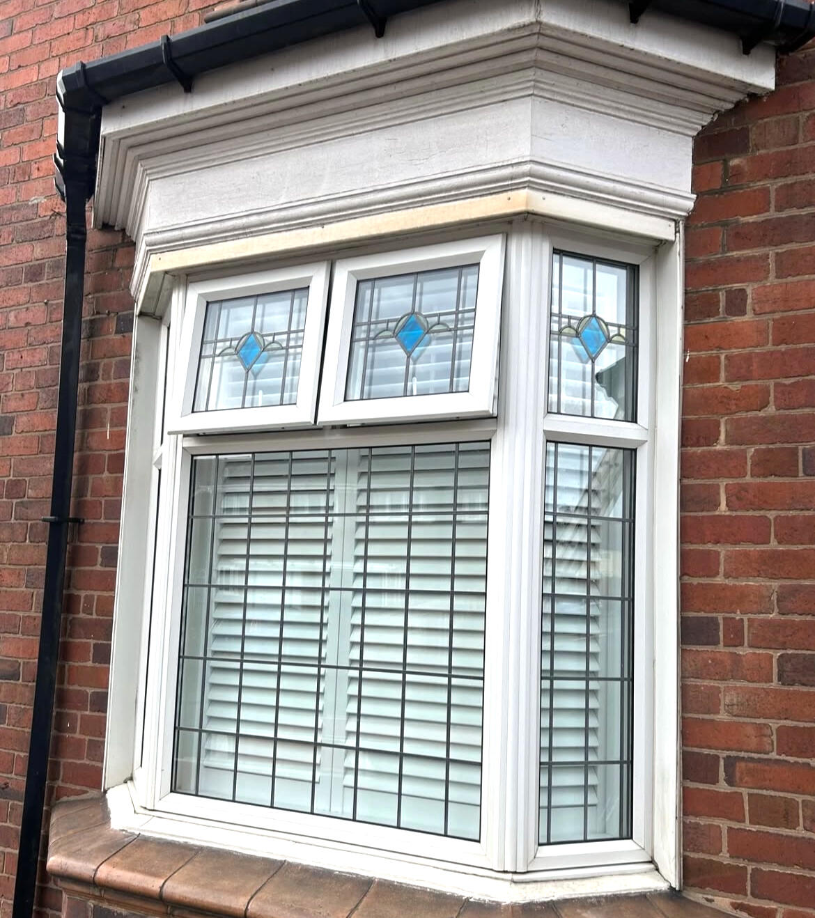 White UPVC bay window before professional UPVC spraying by Wilkinson Specialist Sprays.
