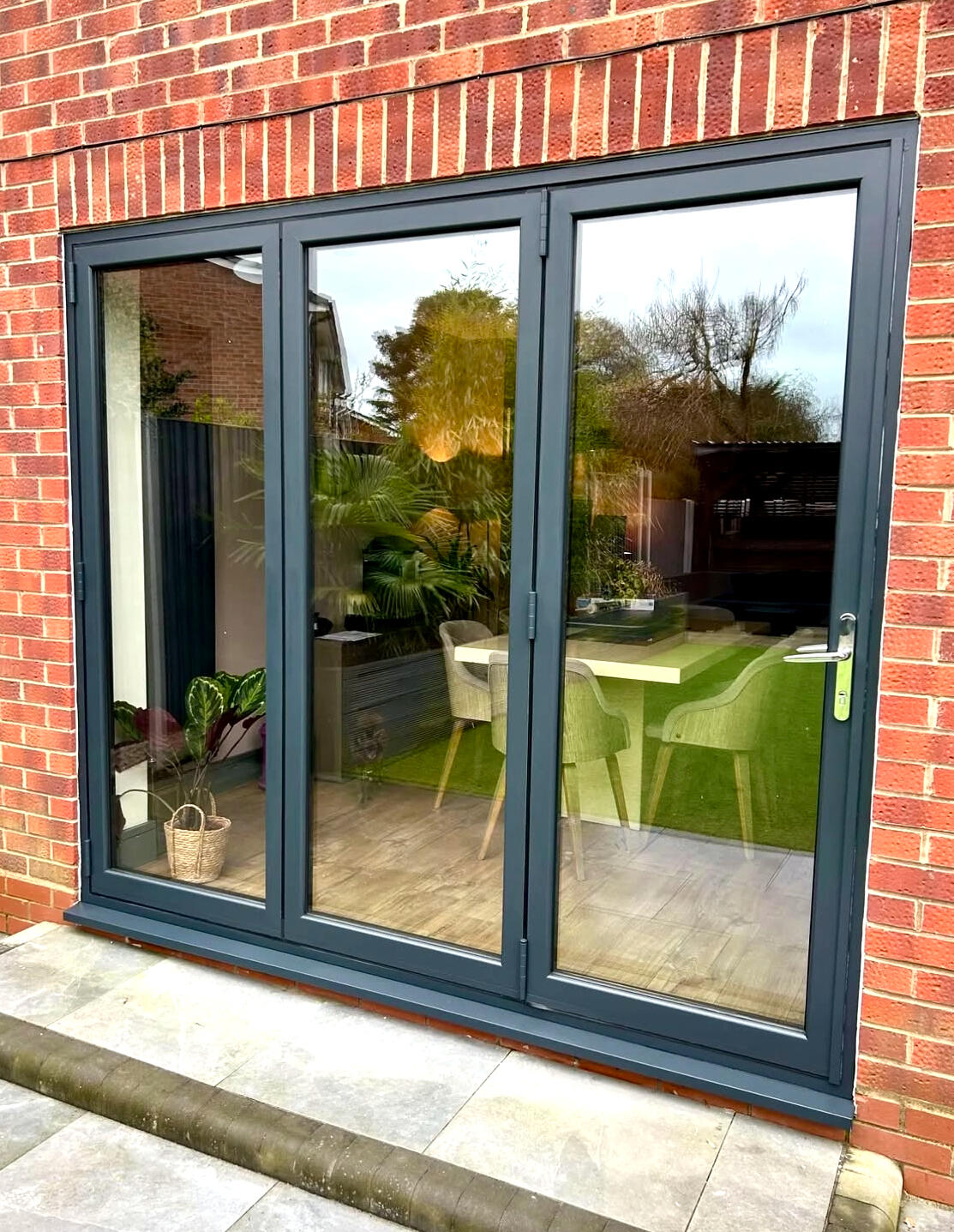 Anthracite grey uPVC French doors after professional exterior spraying with a factory-quality finish.