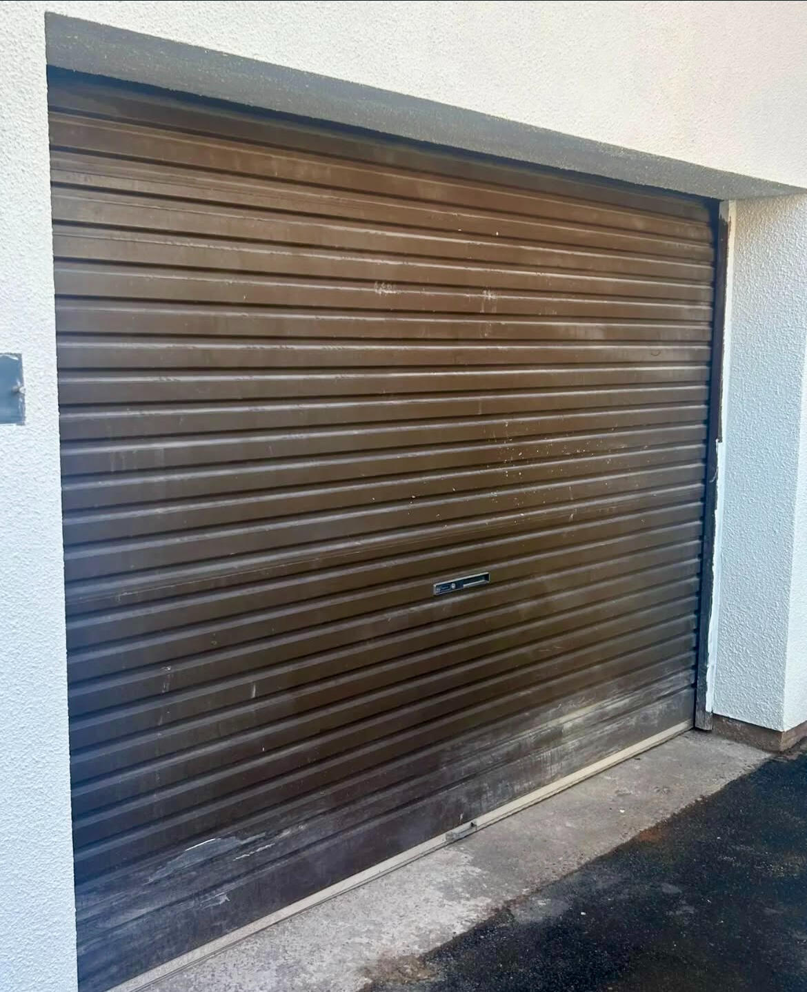 Brown garage door before professional garage door spraying in Wolverhampton.