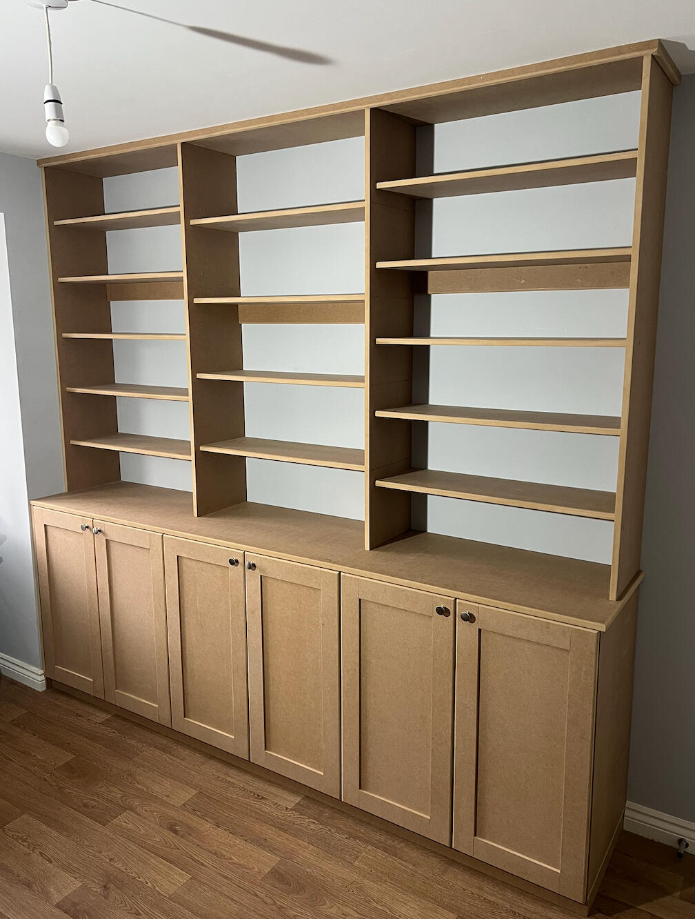 MDF fitted shelving and storage cabinets before professional furniture spraying in Telford.